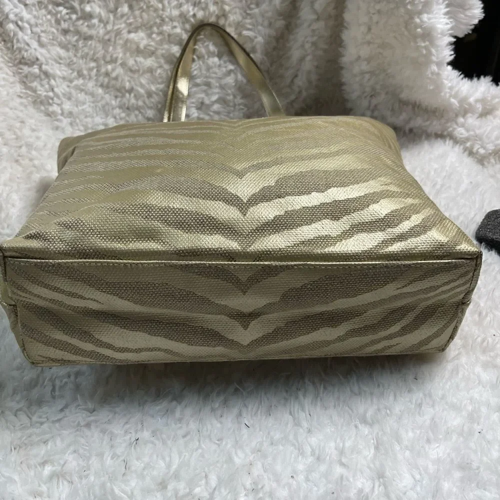 Michael Kors Metallic gold zebra print large tote gold tone hardwares and straps